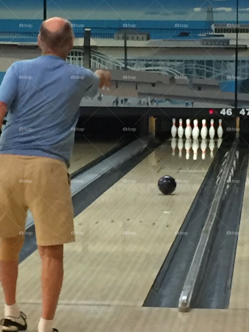 Elderly man bowling