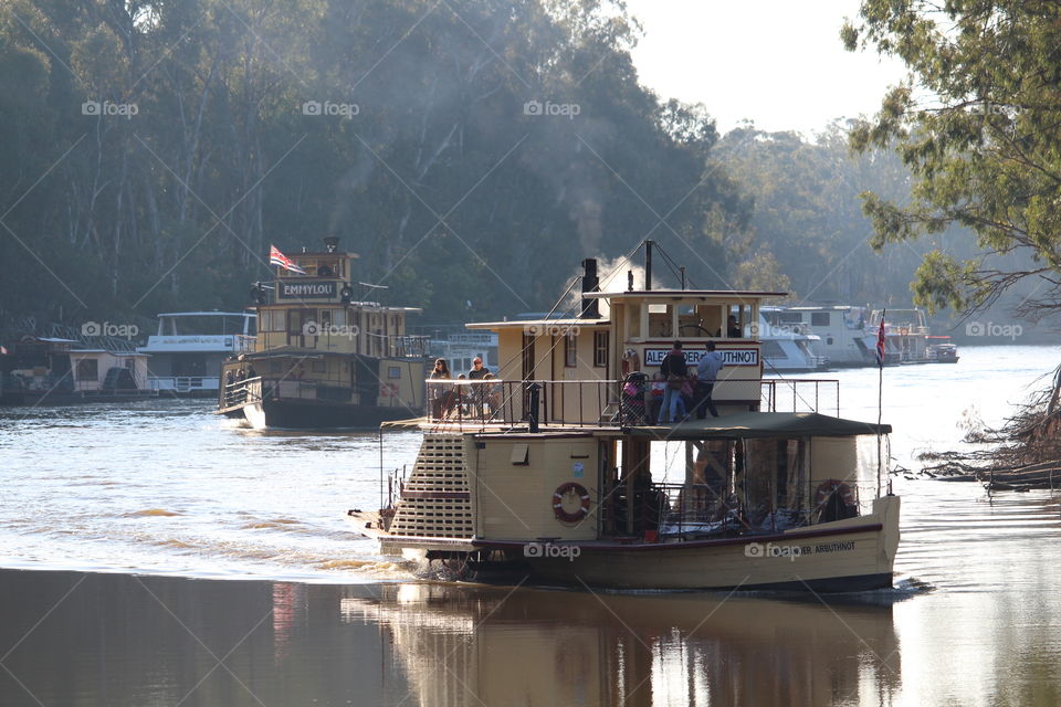 People enjoying the peaceful ride on the paddlesteamers along the Murray River