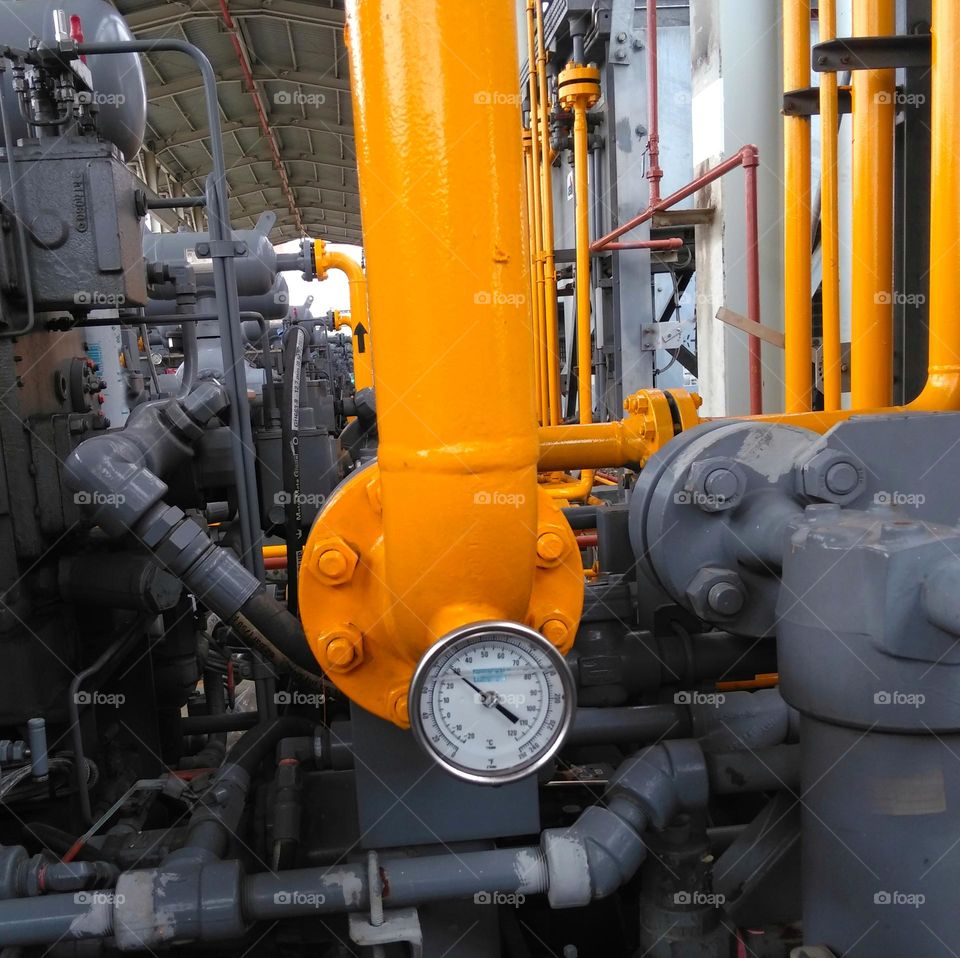 Yellow piping with pressure gauge