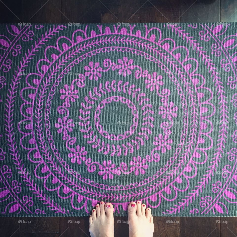 Feet on a yoga mat
