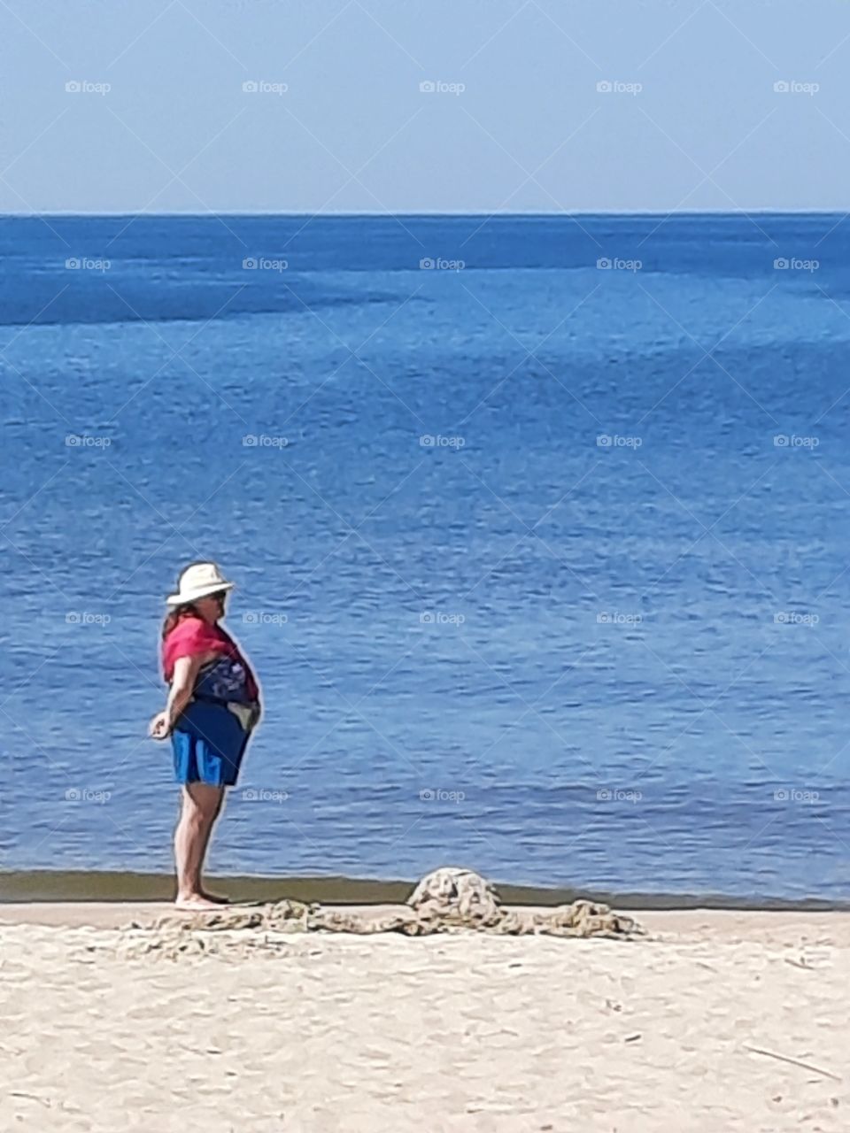 woman enjoying hot summer at seashore