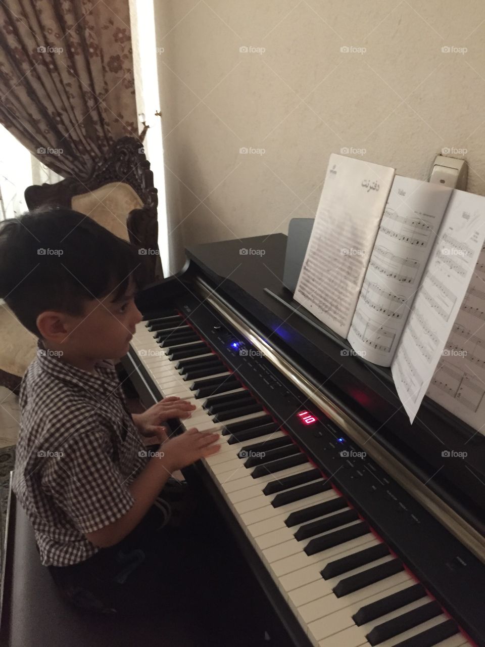 Boy playing piano