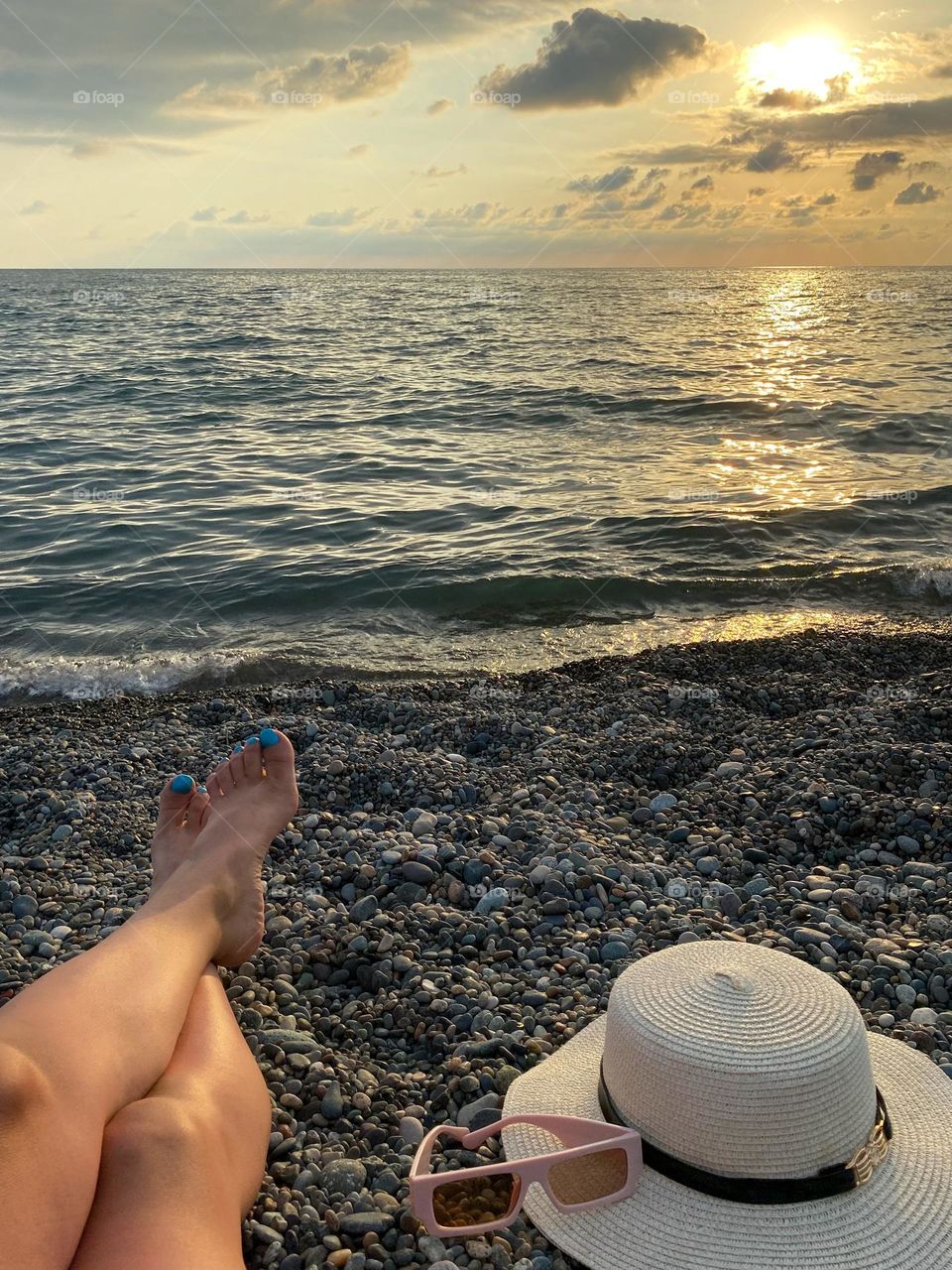 sunhat and sunglasses on the beach