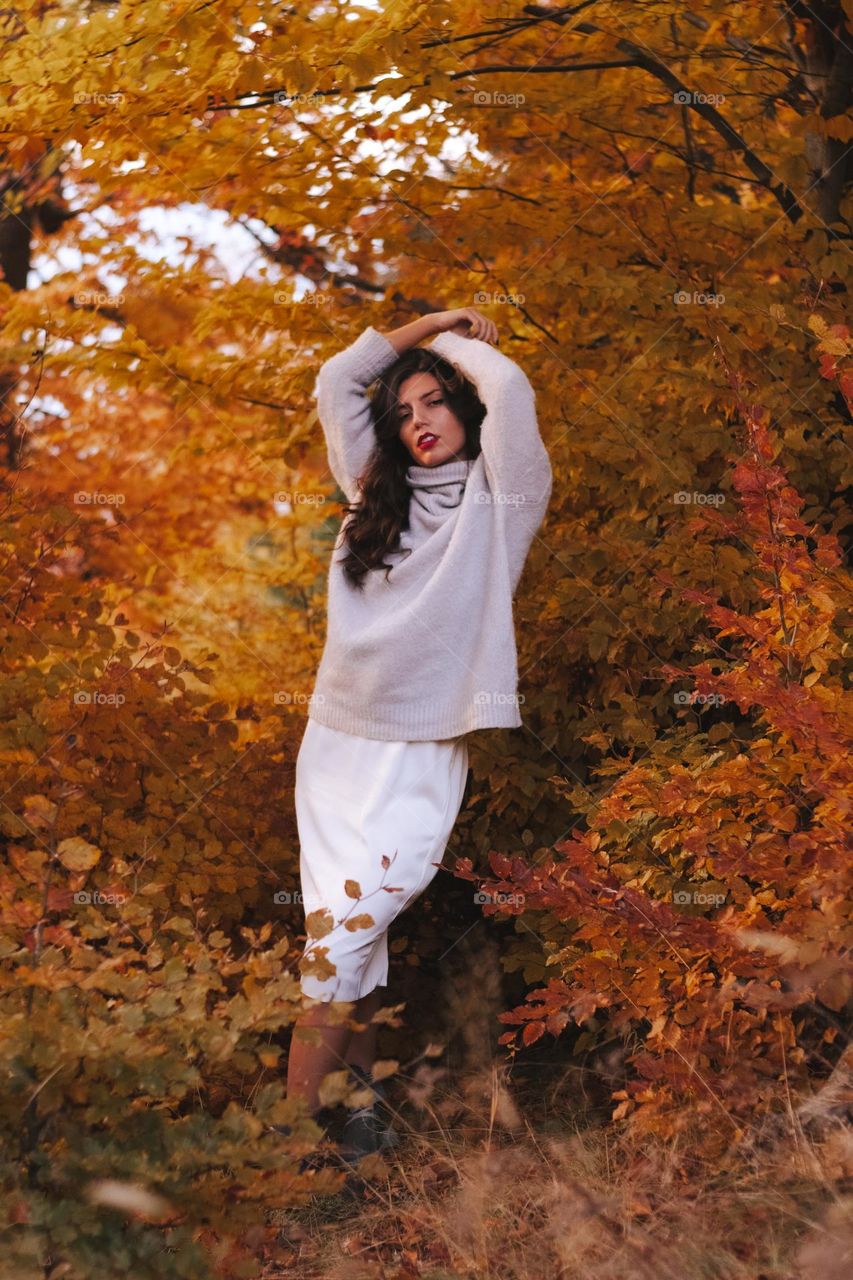 woman enjoying a walk in the woods