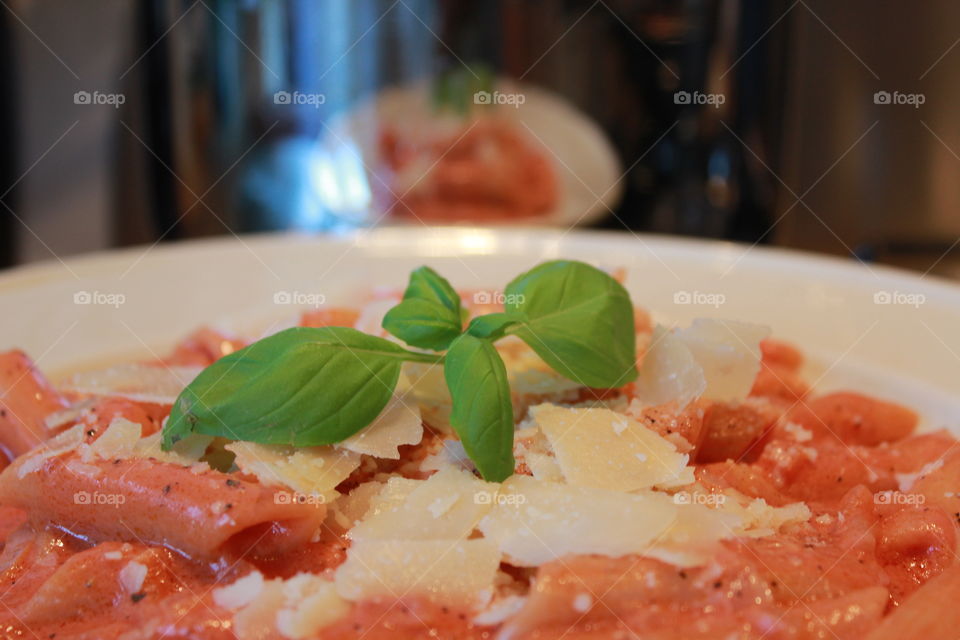 Spaghetti pasta with basil leaf