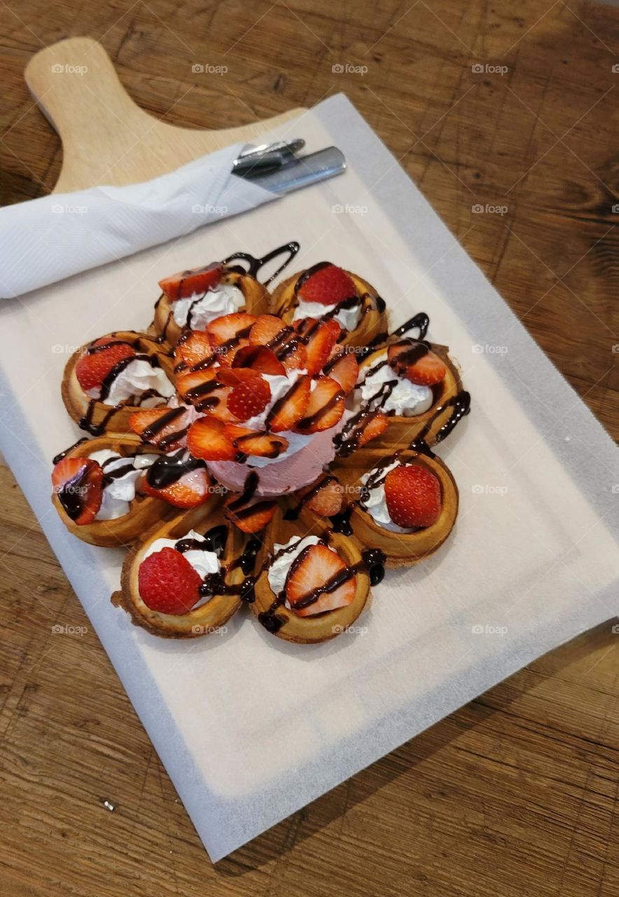 Strawberry Waffles with Whipped cream, Chocolate Sauce and Strawberry Ice Cream