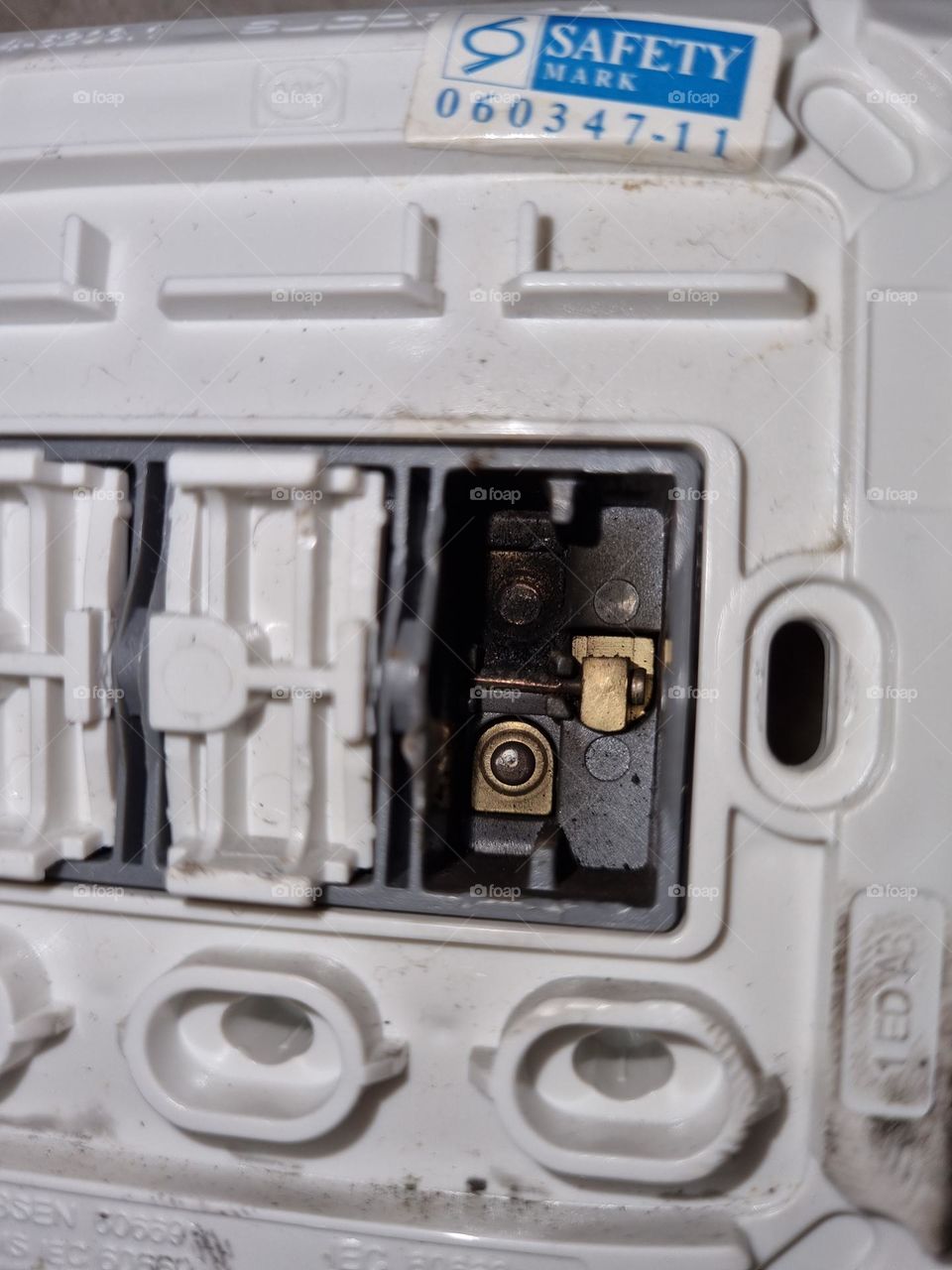 Faulty light switch .... arcing and covered with soot