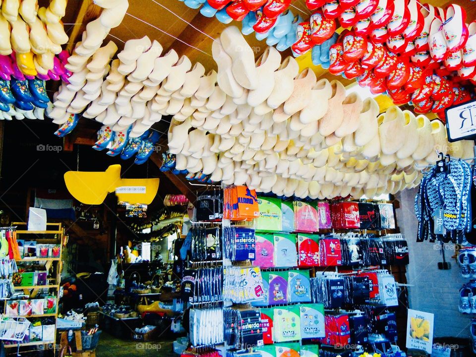 Rows of wooden shoes on display in a souvenir shop in Volendam, a pretty fishing village in Holland. 