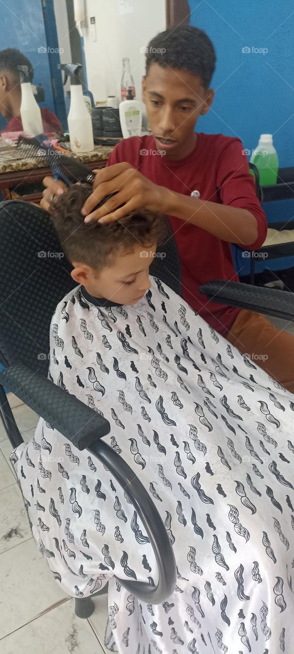 Boy falls asleep while cutting his hair