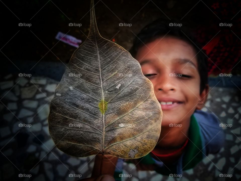 the cute boy after smiling this capture with any expectation to give that poss