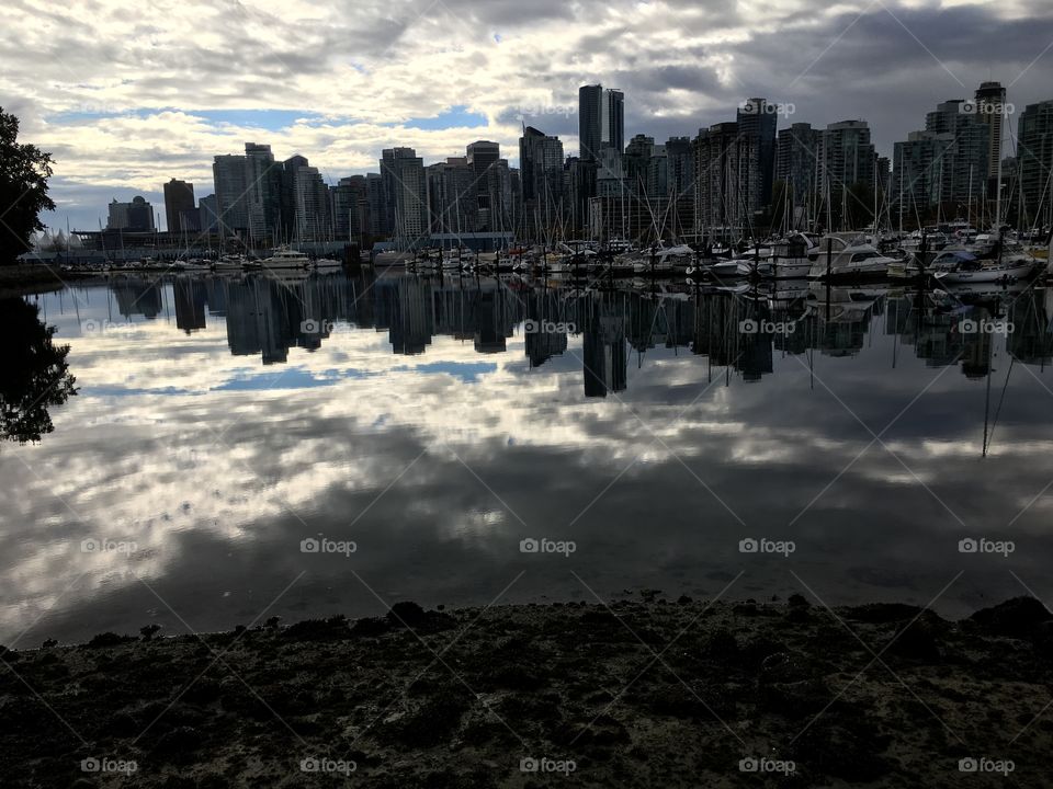 The city skyline reflected in the ocean 