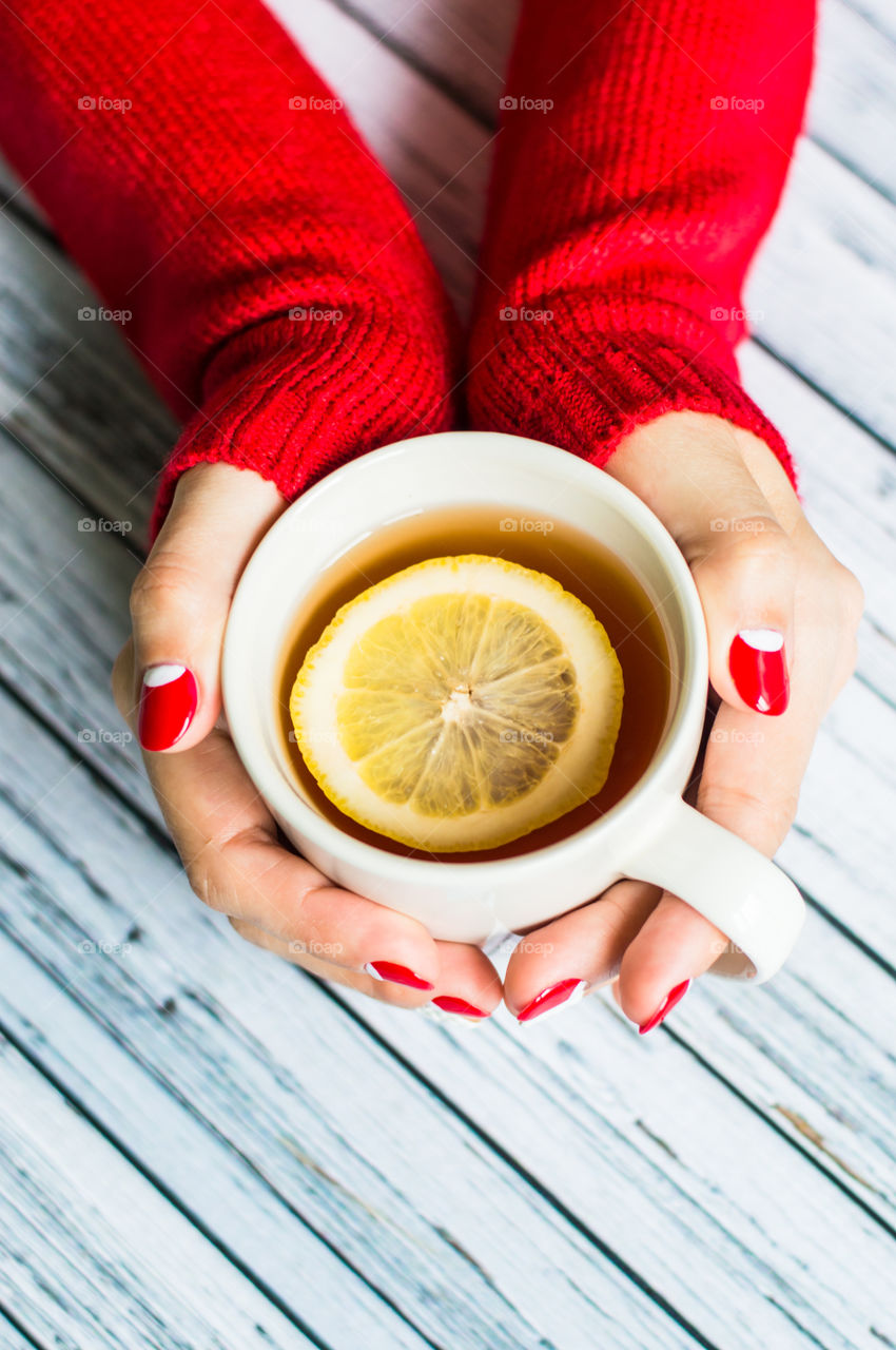 woman hand with cup of tea