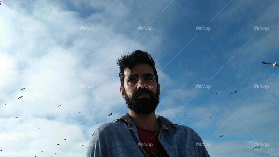 My son looking at the blue sky