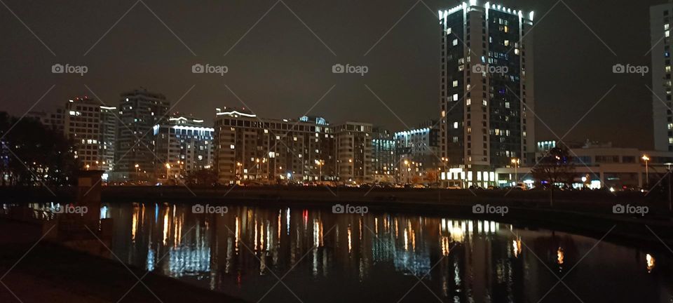 night city wiev beautiful lights and reflection in river