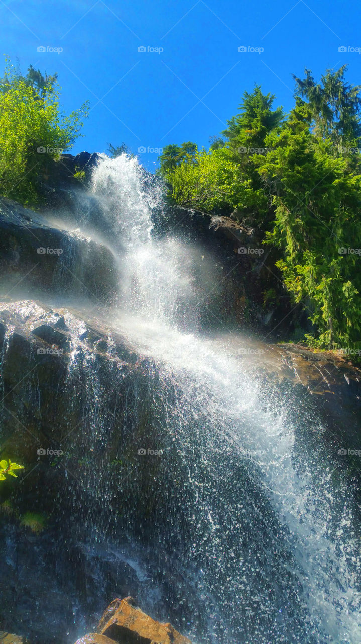 A waterfall on a hiking path.