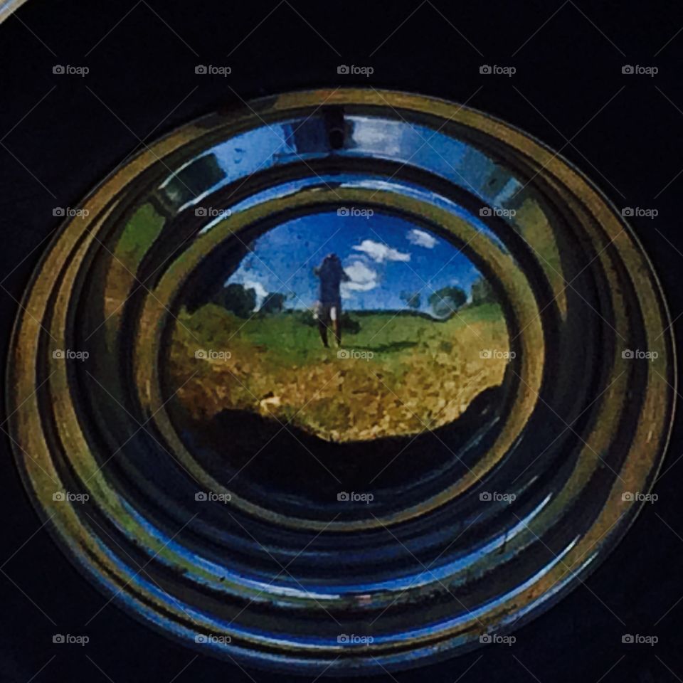 Reflection in a hubcap 