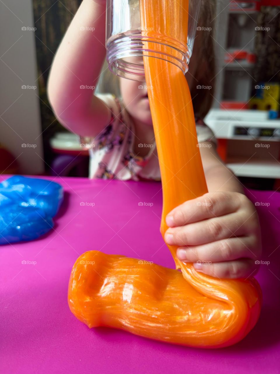 Playing with orange slime 