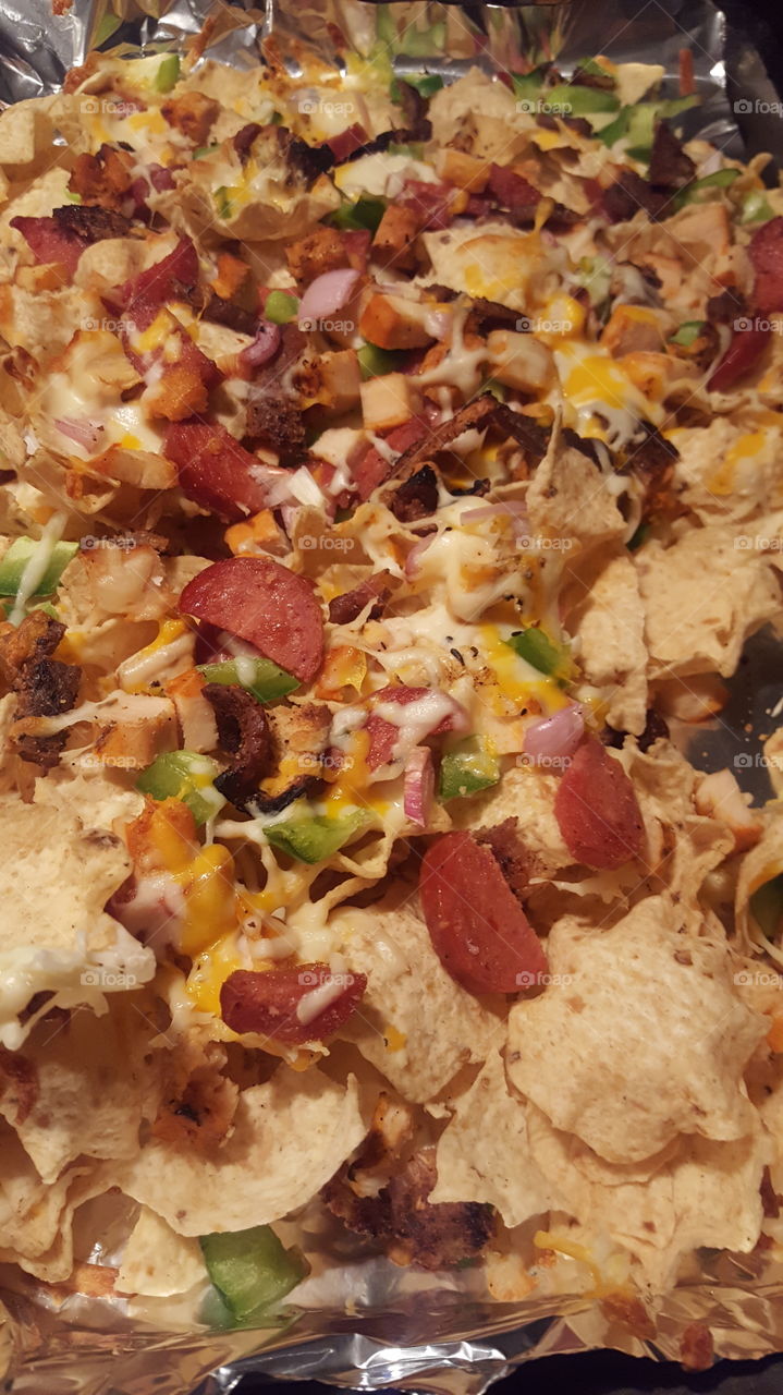 The only way to watch the big game is nachos. Load it up with meat, veggies and of course cheese! Amazing!