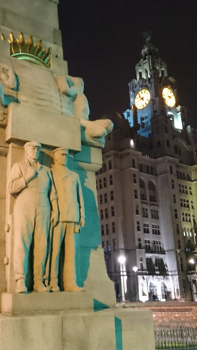Liverbirds and men. legend has it that if the Liver birds leave Liverpool will car to exist 