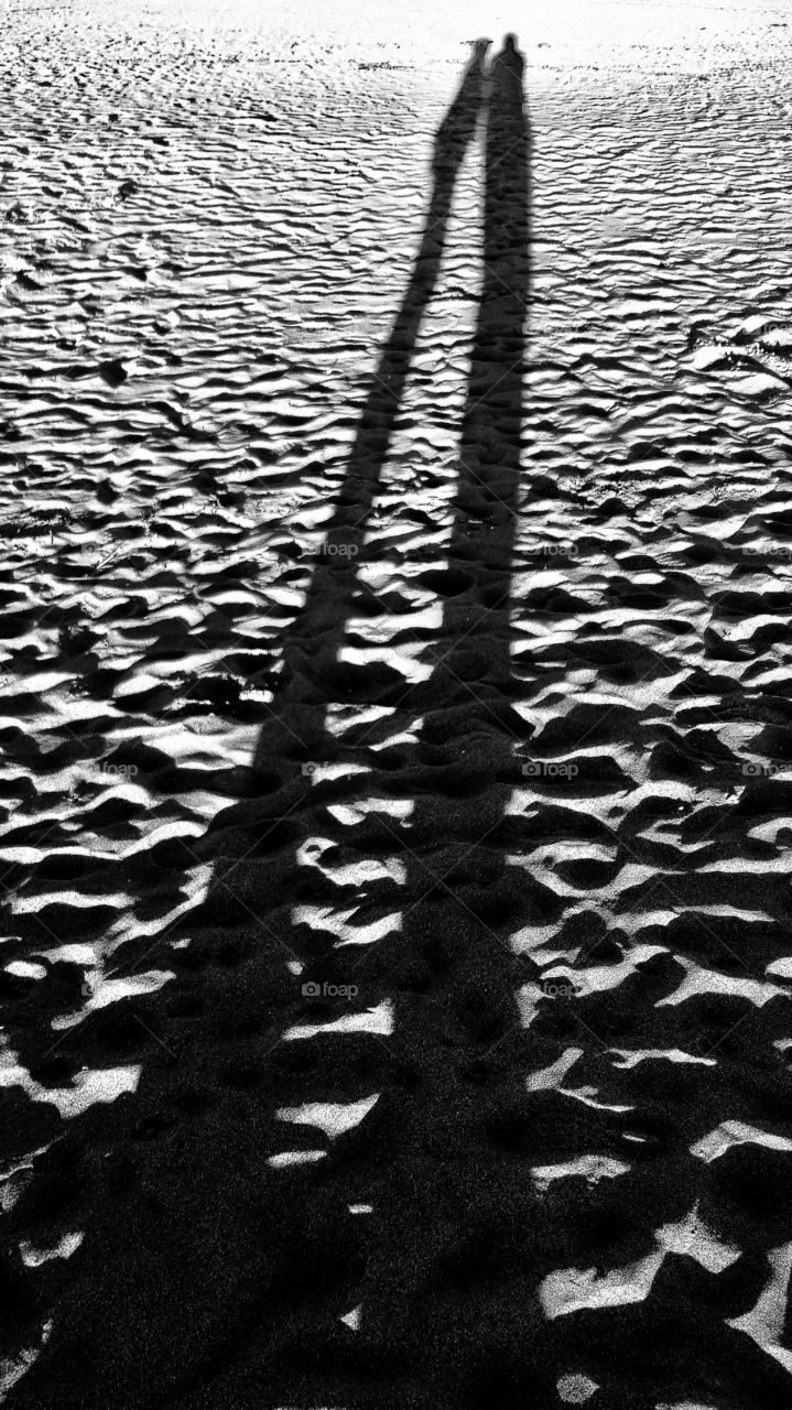 walking together along the beach on an autumn ebening
