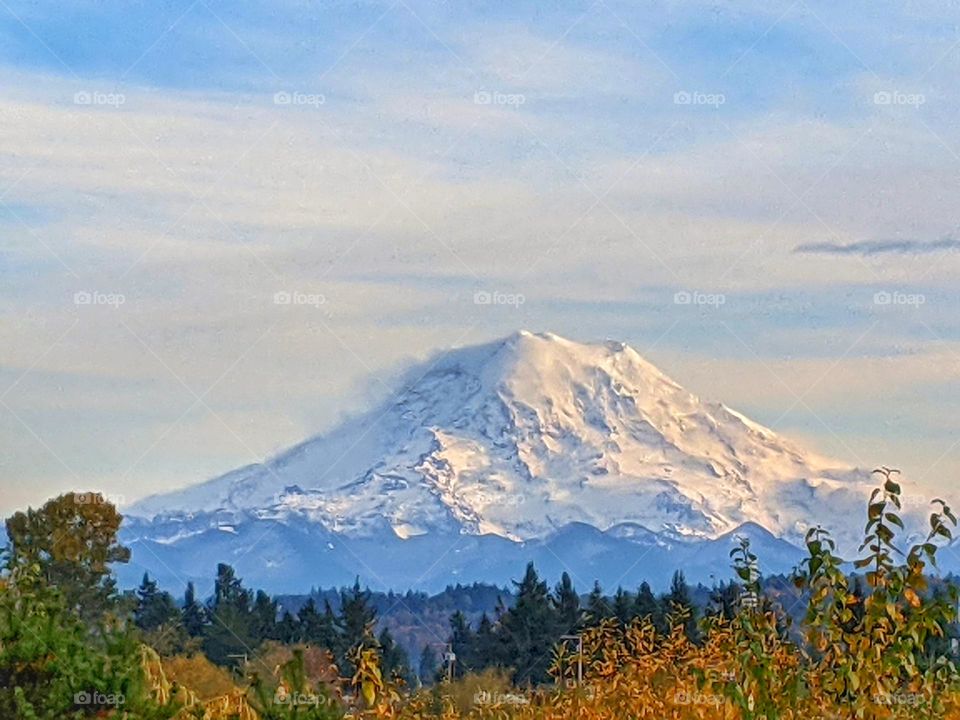 snow capped Mount Rainier on a cloudy day