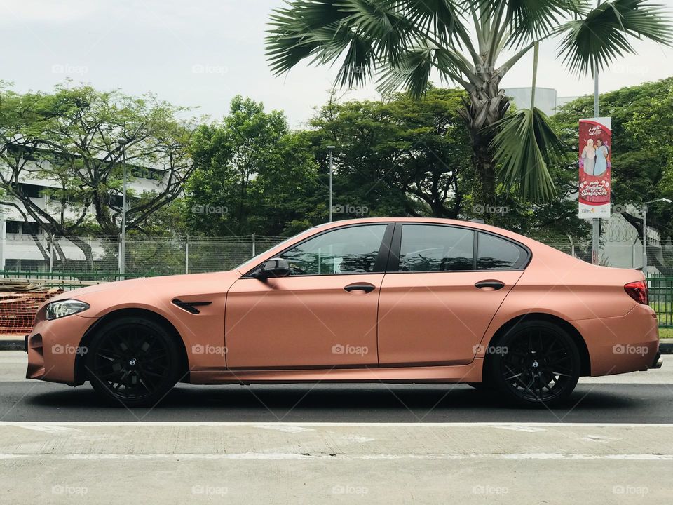 Orange colour car on road 