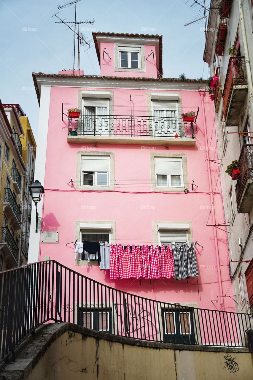 Pink building with hanging clothes