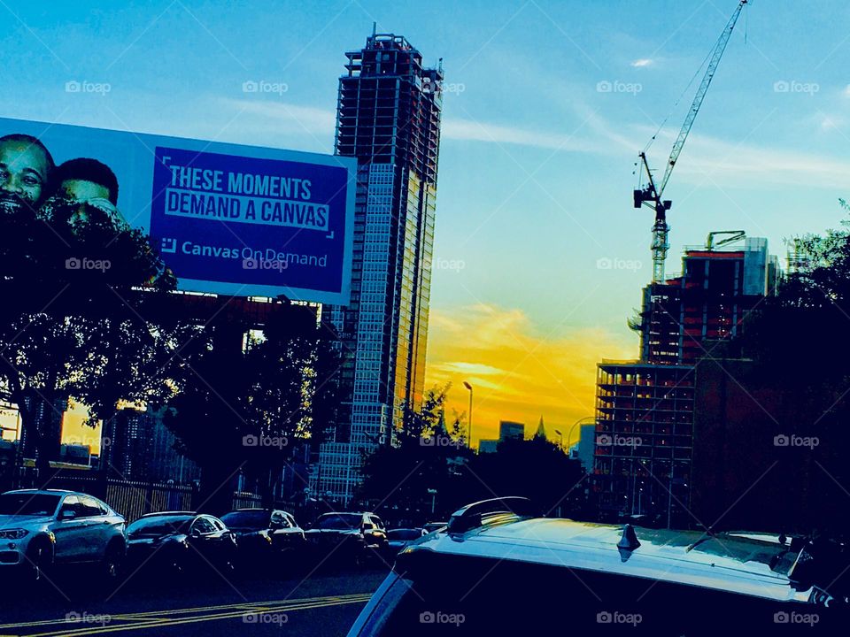 Long Island City, Queens, New York in the golden glow of the setting sun‘s rays at dusk and at the hour of upcoming twilight. Photo from 2018. Hypnotic Productions