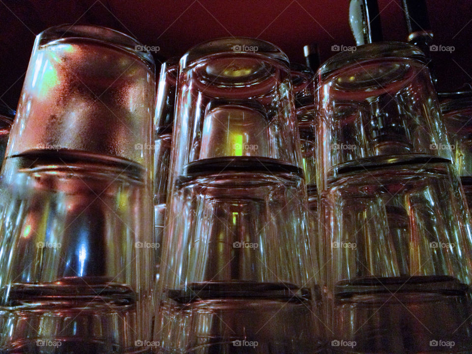 Glasses stacked on a bar