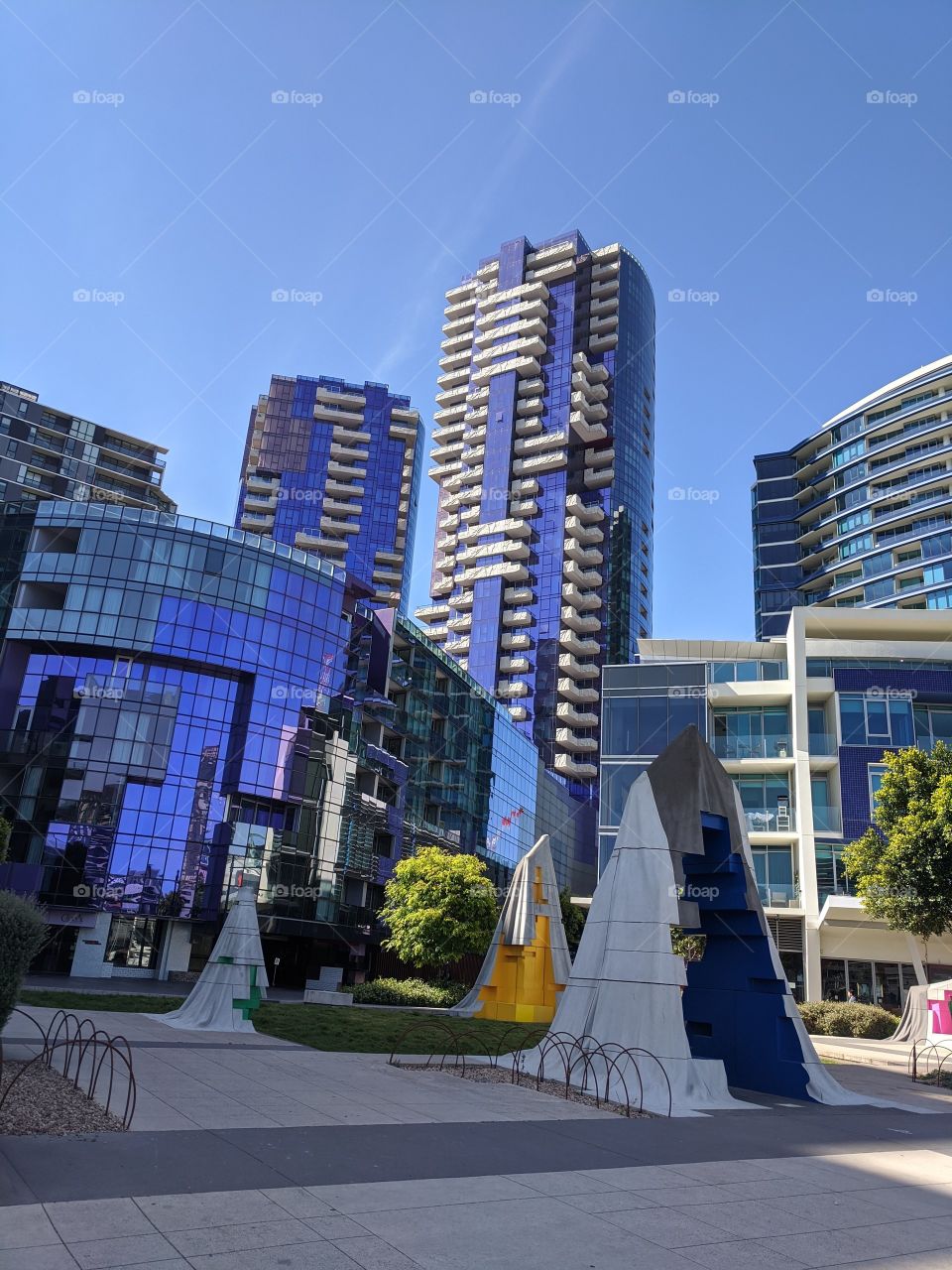 Variety of colourful shaped and interesting glass buildings in urban Melbourne