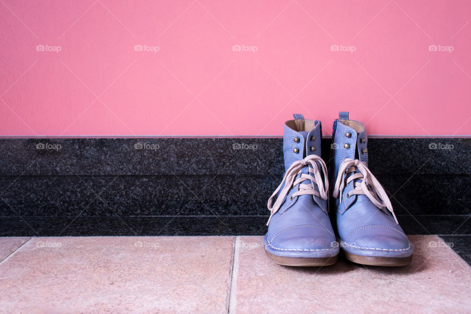 Vintage blue boots on the hallway 