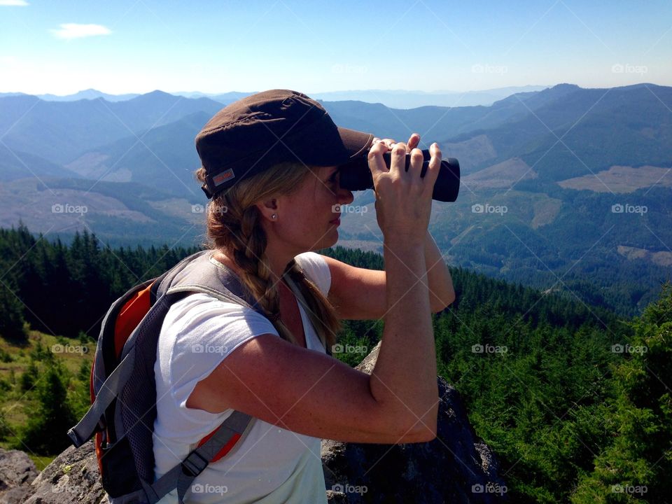 Enjoying The View. Lady enjoying mountain top view 