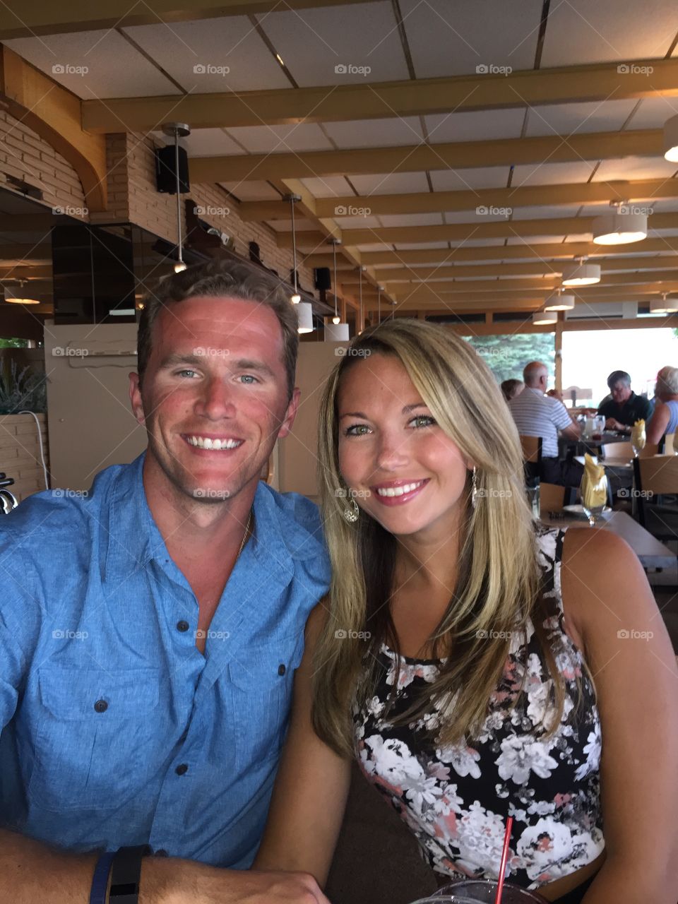 Happy couple sitting in restaurant