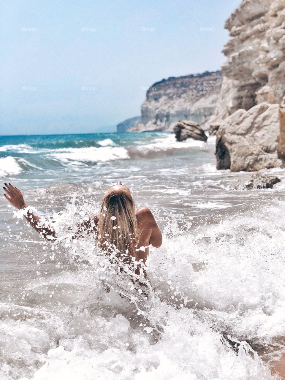 Emotional passion naked woman in sea. Beautiful girl swimming in the sea waves. 