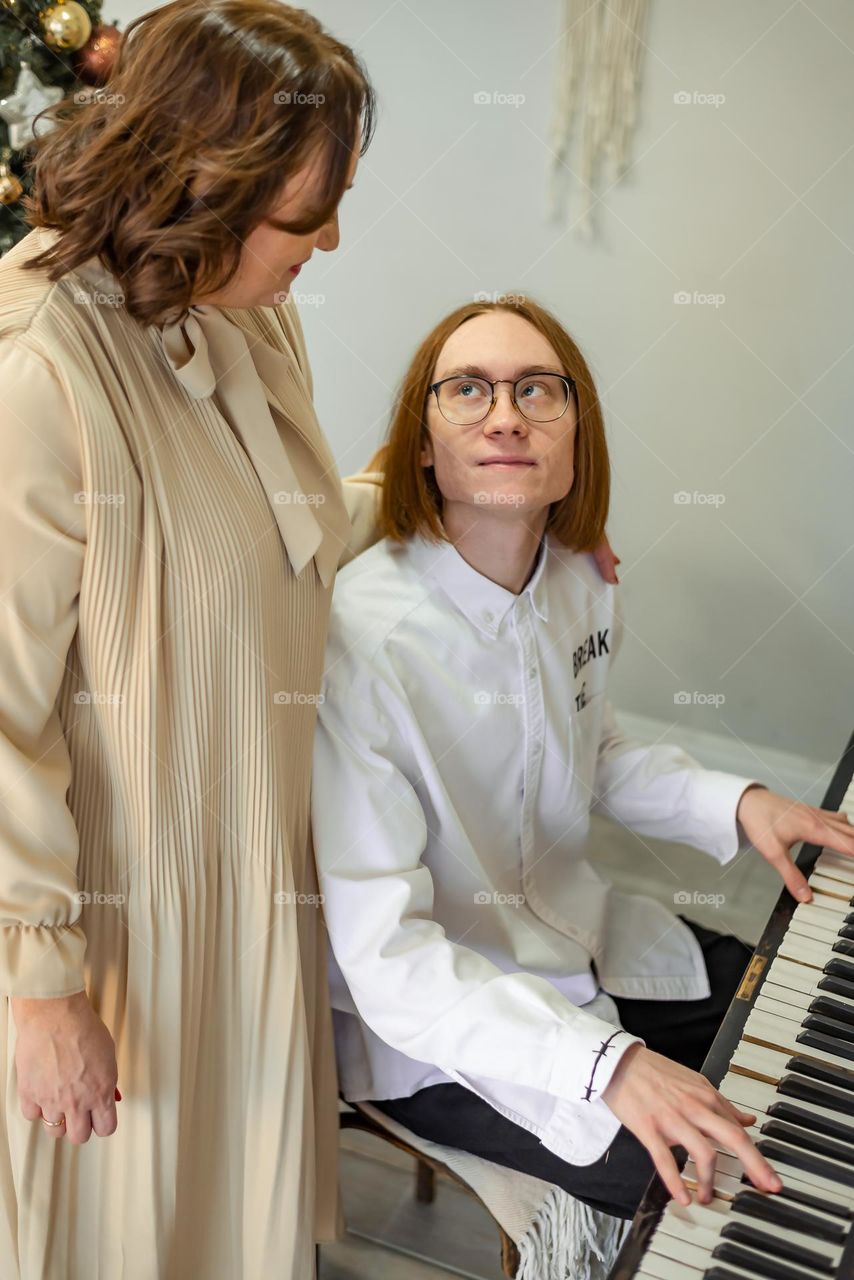 young man playing the piano