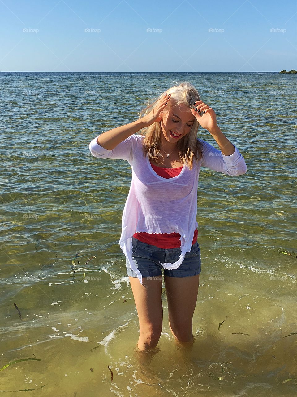 Portrait of a woman standing in sea