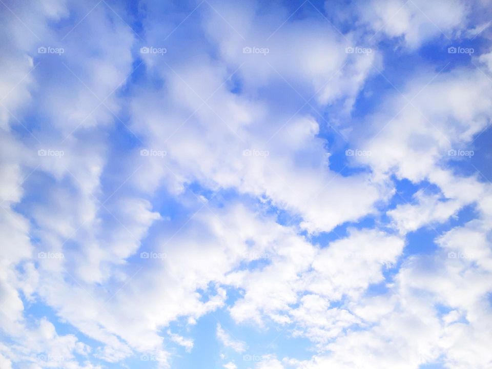 Many beautiful white fluffy clouds were in the blue sky over Central Florida. It was a beautiful day.