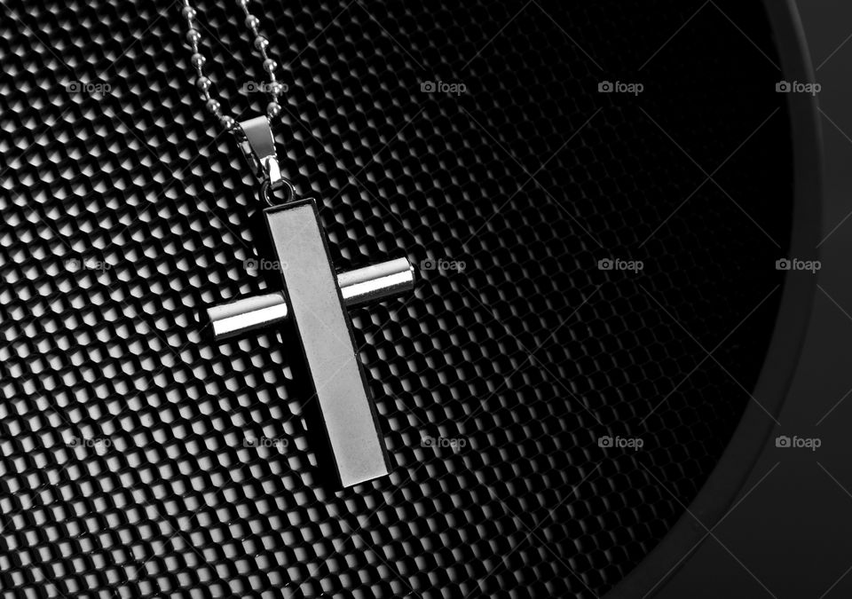 Religious symbol holy cross in an abstract background
