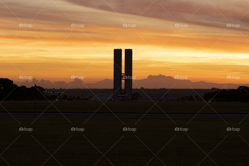 Sunset in Brasilia capital of Brazil. Beautiful day with clouds and orange sky