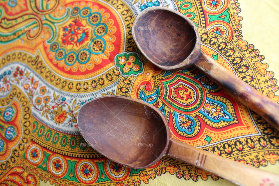 traditional wooden spoons on coloured towel