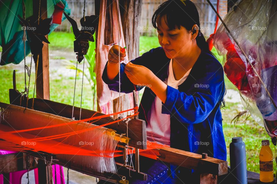 housewife weaving silk.