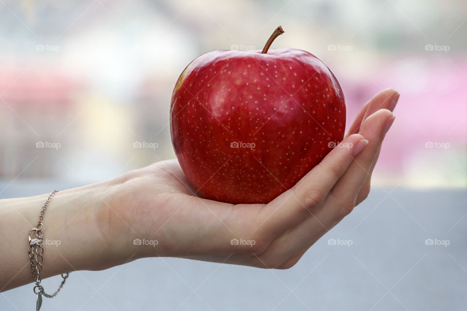 red Apple in hand