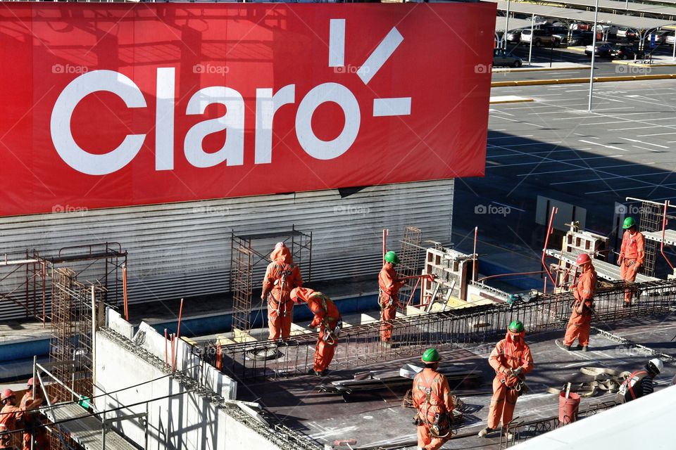 Santiago Airport Chile Claro construction workers . Santiago Airport Chile Claro construction workers 