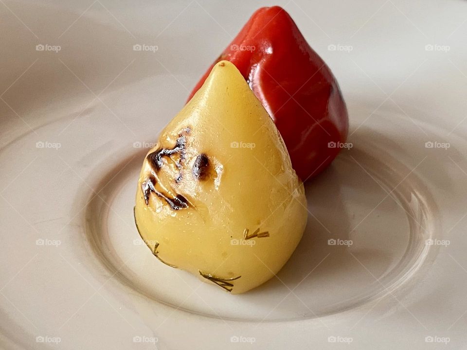 Two chilli habanero peppers green and red