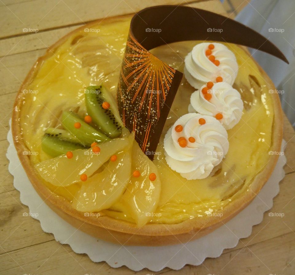 Pear and custard pie with whip cream,  kiwi and painted chocolate garnish made by myself :)