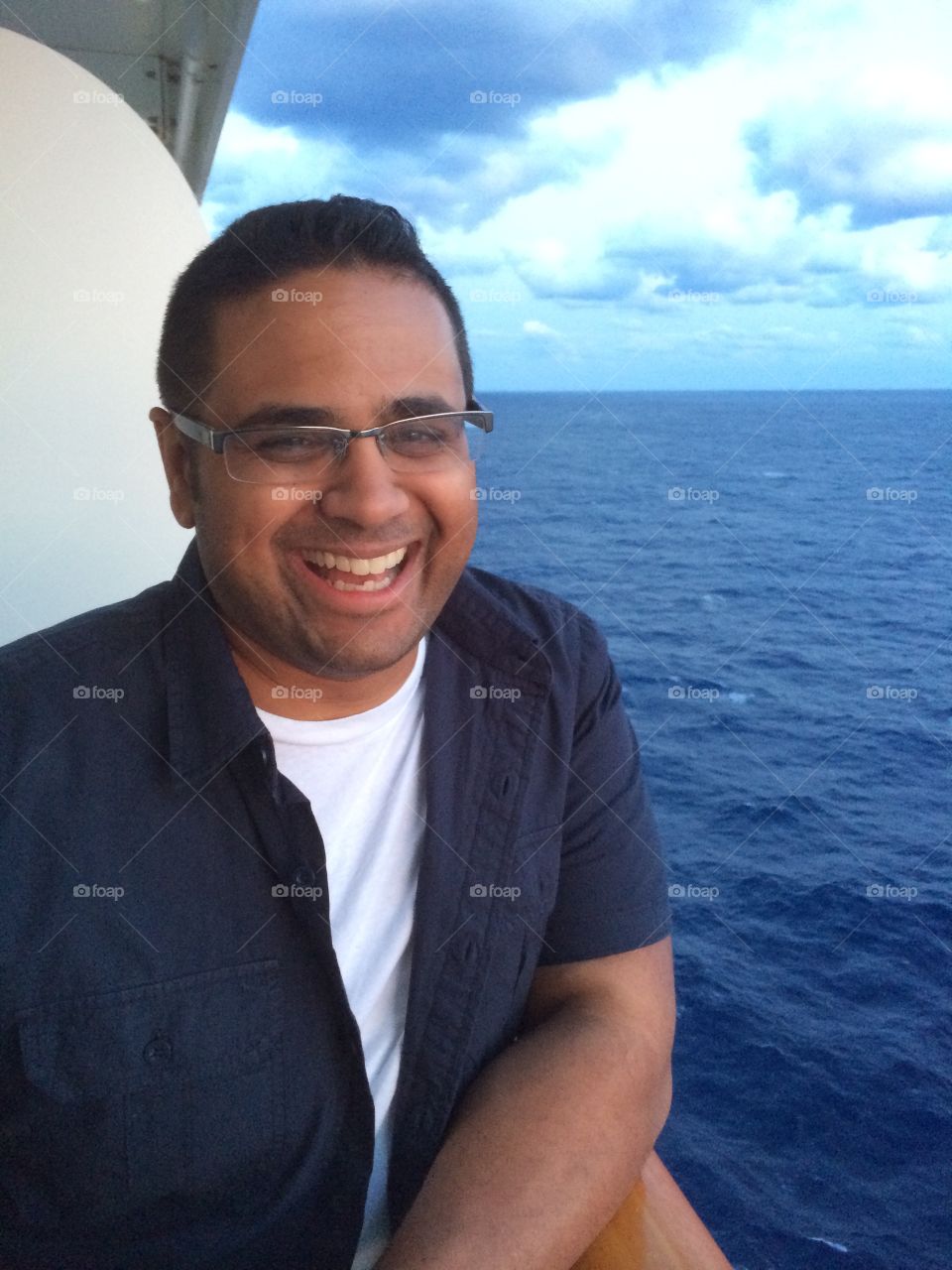 Sri Lankan American having a good old time on the balcony of a Norwegian cruise, New York to Bermuda. Taken May 2014.