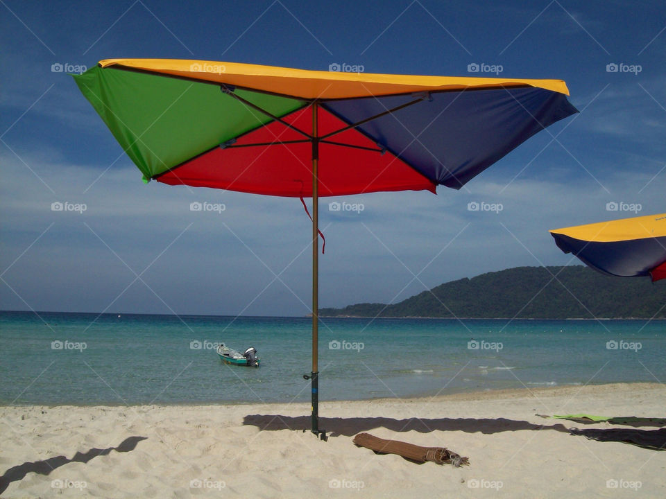Parasol on long beach.