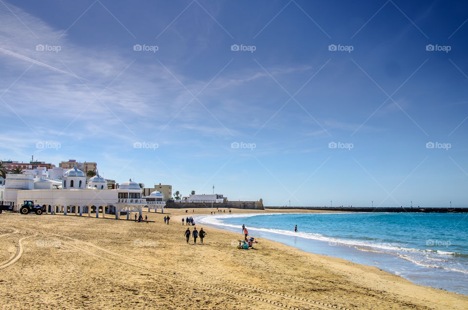 Spring in Cadiz, Spain . People enjoying the beach in Cadiz on a spring day