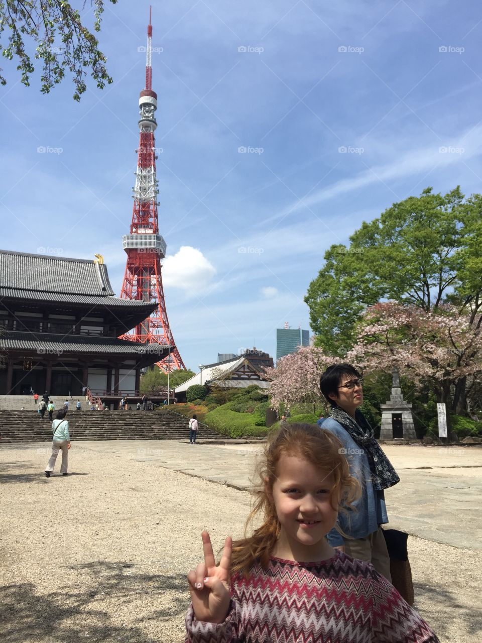 Little girl showing victory sign