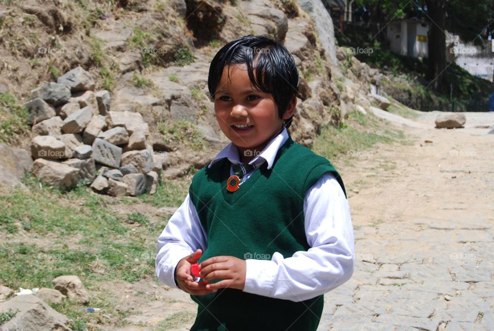 portrait of a young girl wearing school uniform